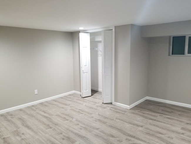 Bedroom with large Closet - 44 Kenyon Ave Unit 1 BR Apt w Spiral Stairs