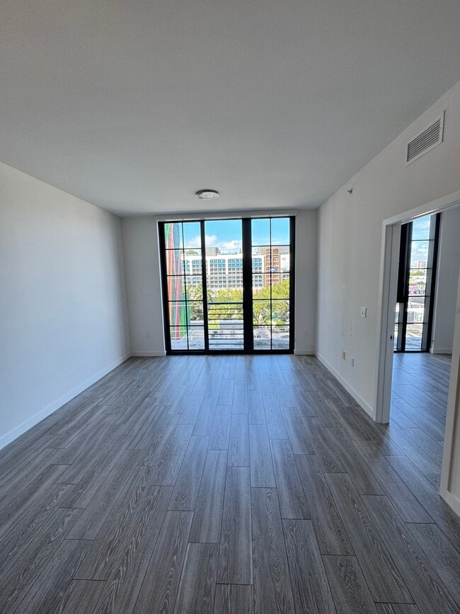 Living Room Floor to Ceiling Window - 160 NW 27th St Unit A2
