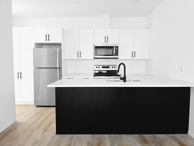 Photo - 11919-11955 55 St NW Unit MAIN 2