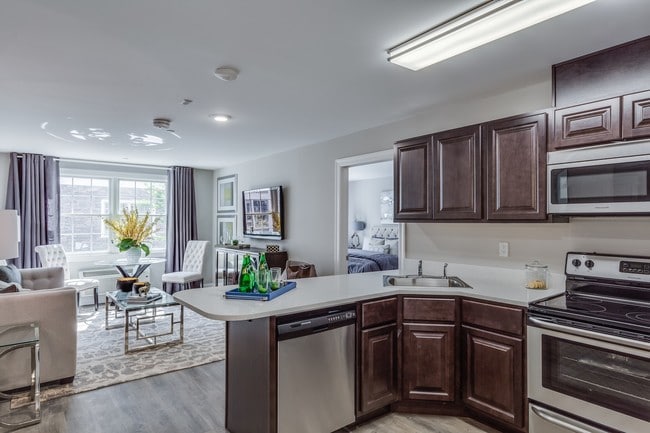 Kitchen and Living Area - Fairfield Fieldstone At Farmingdale Apartments