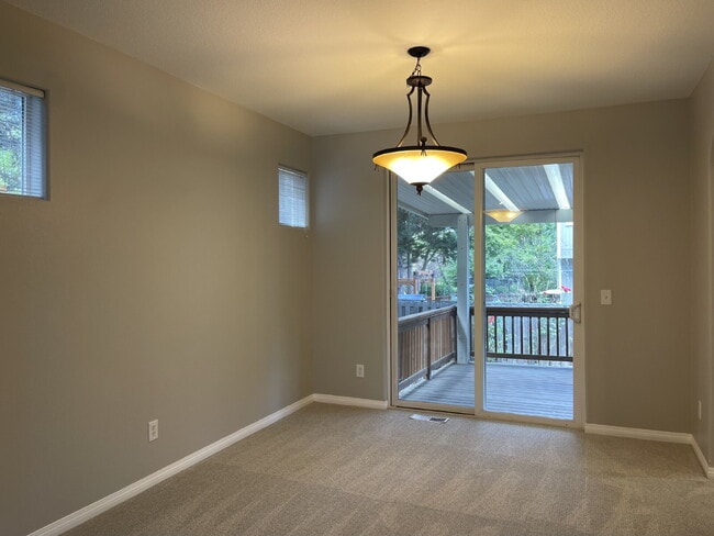 4-Bedroom Happy Valley Home with Large Garage, Spacious Living Areas & Covered Deck