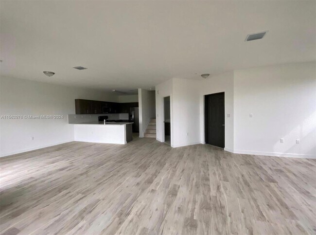 Living Room/Stairs - 15600 SW 136th St Unit 202