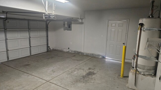 Photo - Three Bedroom Two and a half bath house, 2 car garage, central air. Available now.