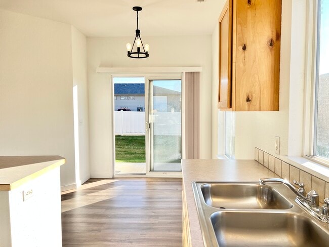 Dining Area and Patio Door (View from Kitchen) - 139 N Plummer Rd