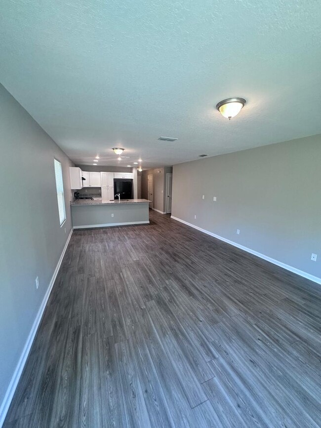 Photo - Gorgeous 4-Bedroom Home with Granite Counters & 2-Car Garage