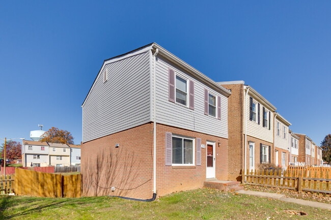 Photo - Spacious end-unit three-level townhome fea...