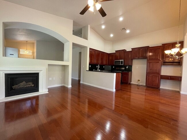 Photo - Fireplace in Living Room, Backyard Patio, Hardwood and Laminate Flooring