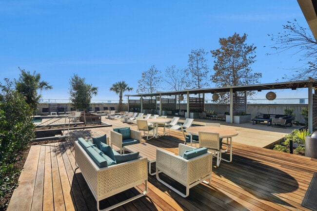 Luminary_EXT_Amenity_PoolDeckDining_Feb2026 - Luminary Residences