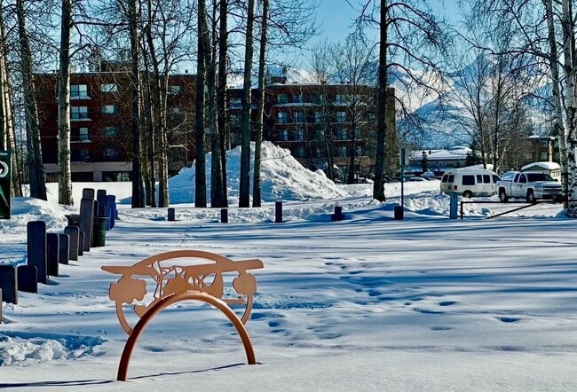 A view of the building from Spenard Lake - 3105 Lakeshore Dr Unit 406 Building B