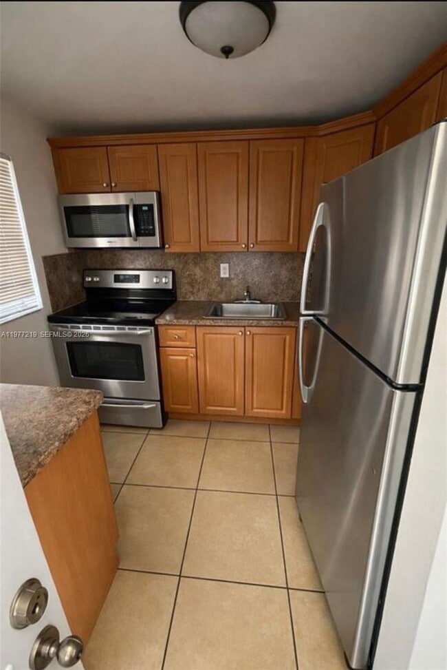 Building Photo - 1735 W 60th St Unit M201