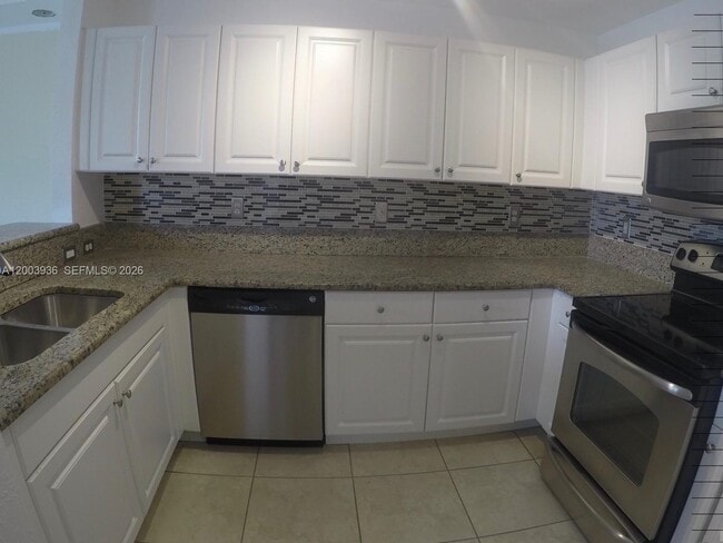 Building Photo - 11401 NW 89th St Unit 105