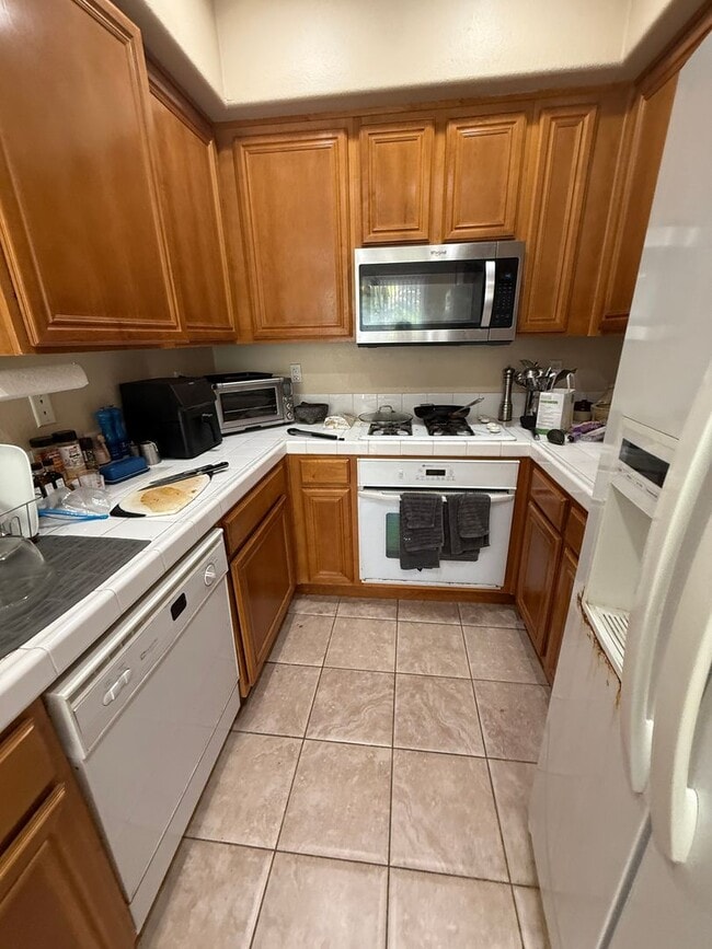 Photo - Gated 3 br townhome 2 garages fenced yard