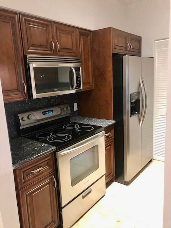 Photo - Spacious 1-bed, 1-bath condo is nestled in the gated waterfront community of The Yacht Club at Av...
