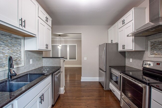 Building Photo - Adorable Brick 4 Bedroom Ranch with Finish...