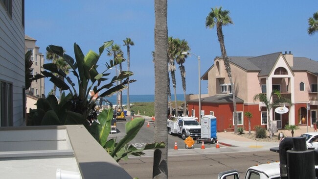 Building Photo - Condo with 2 car garage across from the beach