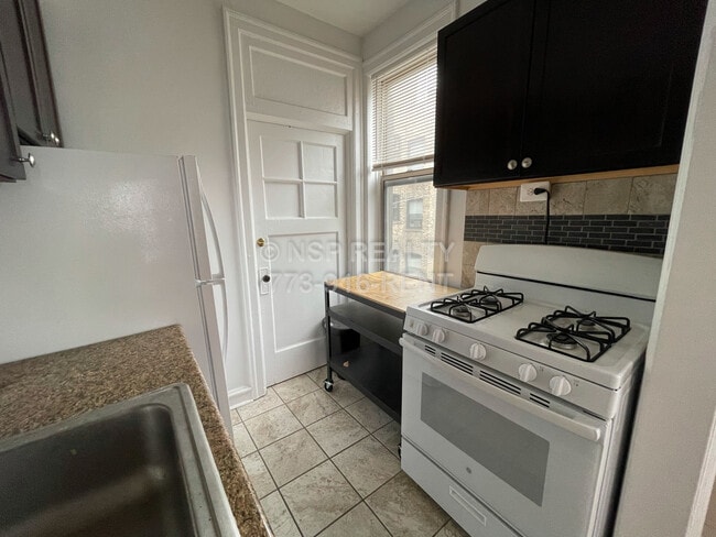 Building Photo - 1367 W Estes Ave Unit 2K Rental