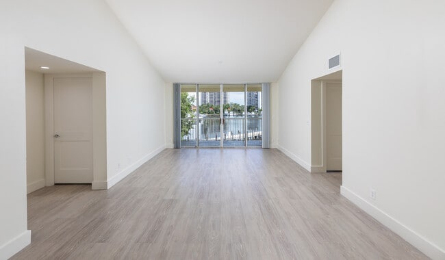 Spacious living room with wood flooring throughout