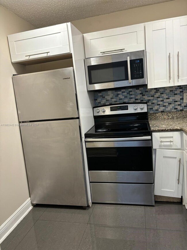 Photo - 496 NW 165th St Condo Unit D-516