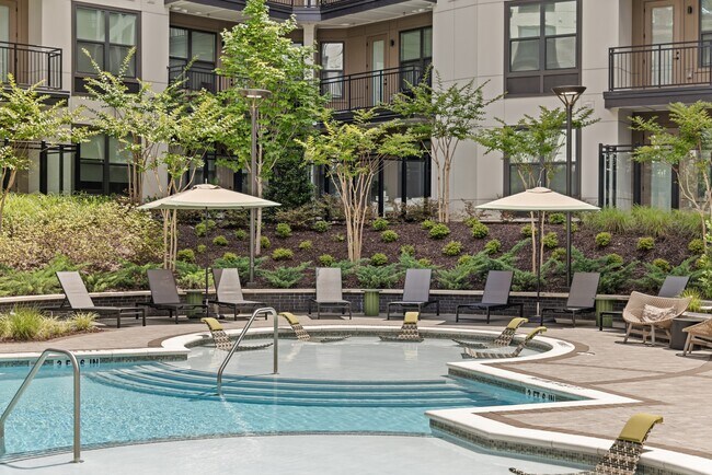 Resort-style Swimming Pool with Tanning Ledge, Cabanas and Sundeck - Bexley Chamblee