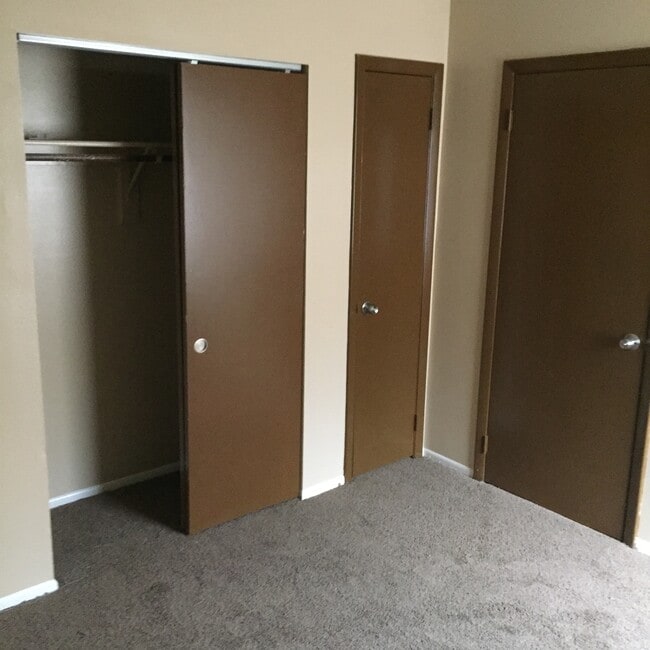 1st Bedroom with double closet, linen closet, newer carpet. - 2410 S San Gully Rd