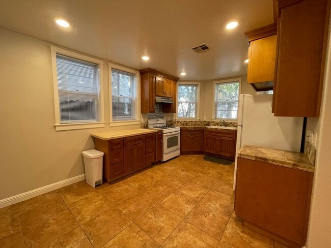 Photo - Spacious 2 Bedroom, 2 Bath, 2 Car Garage with Washer Dryer! Unit 1822-B