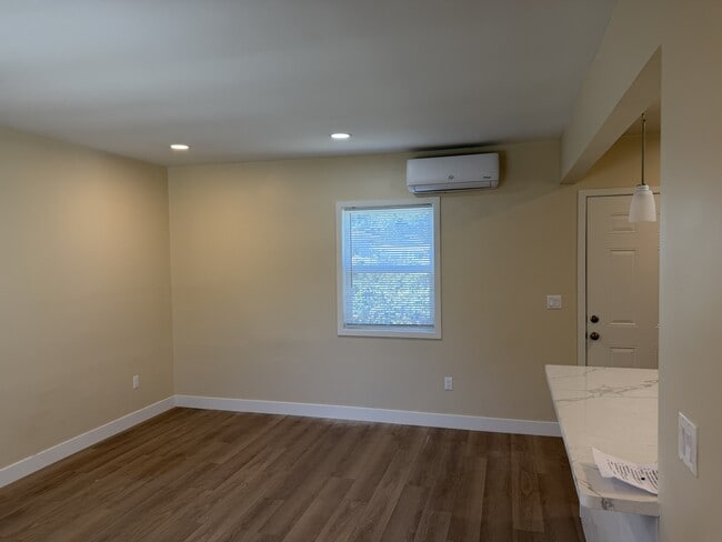 living room with A/C and heater - 619 Linwood Ave Unit B