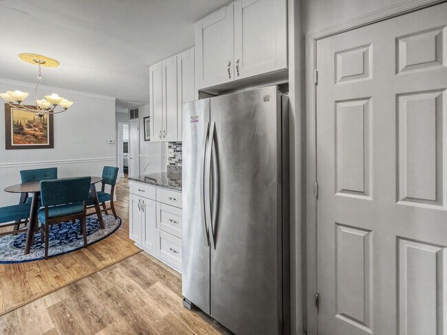 Photo - Furnished 4BD 2BA Home with Two kitchens, Basement, and Garage!