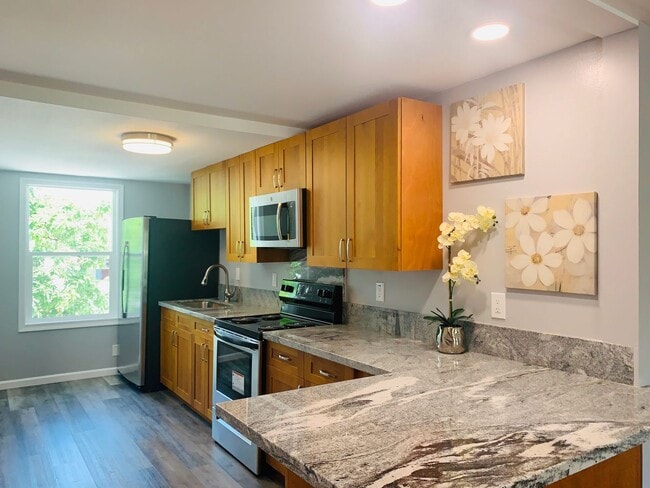 Photo - Spacious upstairs unit. Large Living area. Parking Available