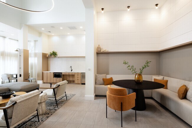 Resident lounge with kitchenette and seating - Avalon Fairway Hills-Meadows