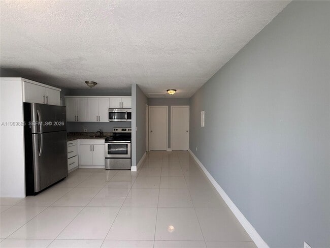 Building Photo - 2401 NW 82nd St Unit Rear