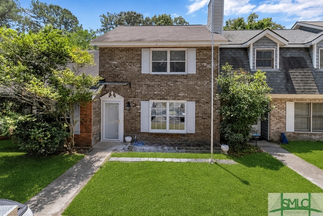 Building Photo - Spacious 2-Bedroom Brick Townhome with Private Fenced Yard