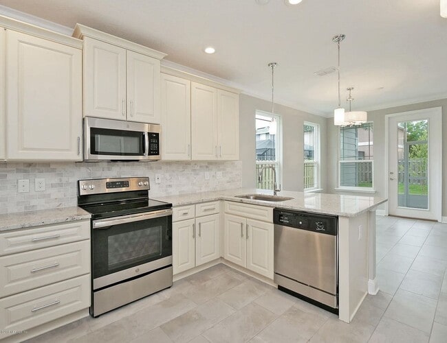 Photo - 4 Bedroom 3.5 bath Beauty in Just a Short Stroll to Jax Beach - Garage, Lawncare Included & Fence...