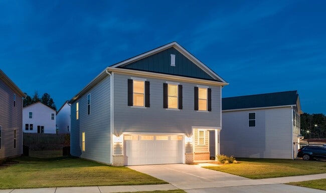 A private single-family home at Amavi Brier Creek, offering modern design, an attached garage, and a quiet Durham setting near Brier Creek conveniences.