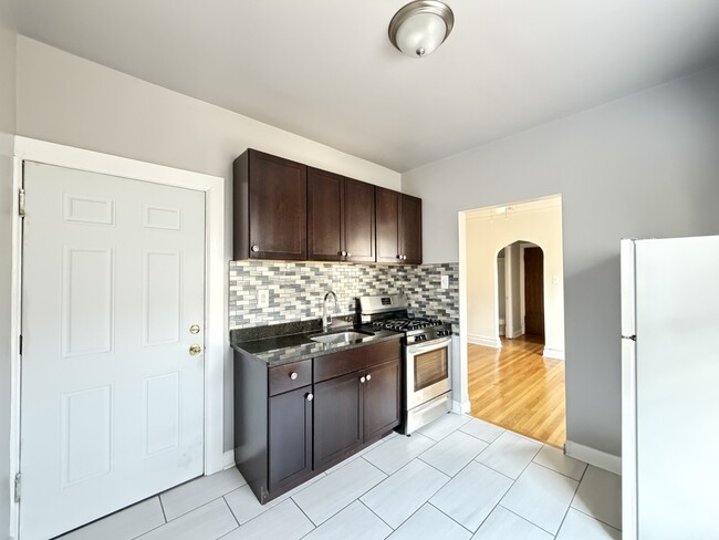 Building Photo - 6328 N Magnolia Ave Unit J01P