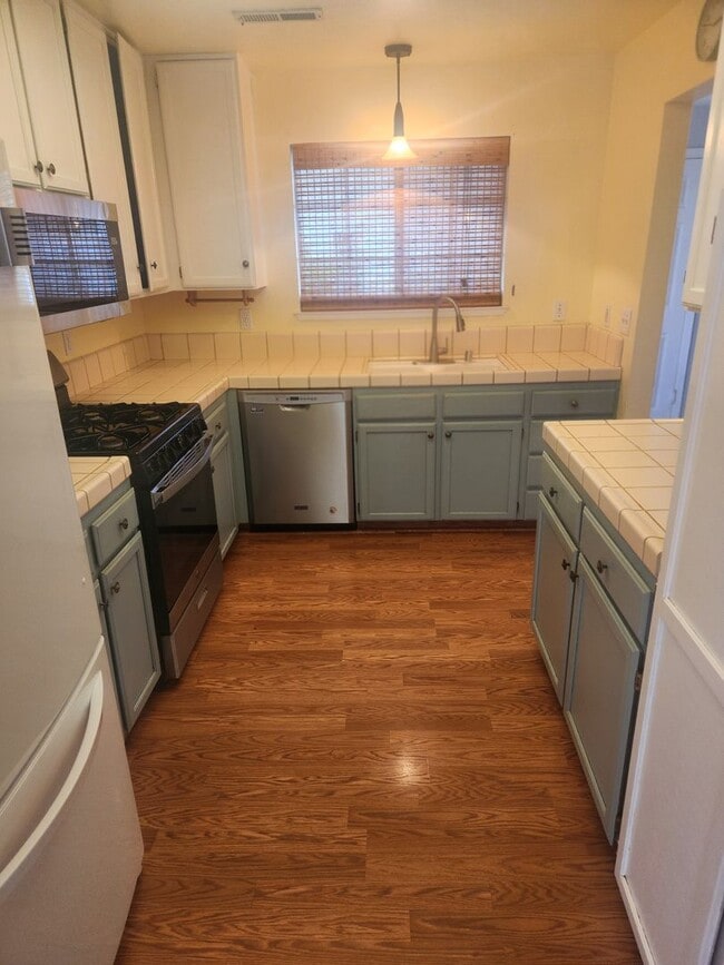 Photo - Beautiful well maintained two story, two bedroom townhouse with private backyard.