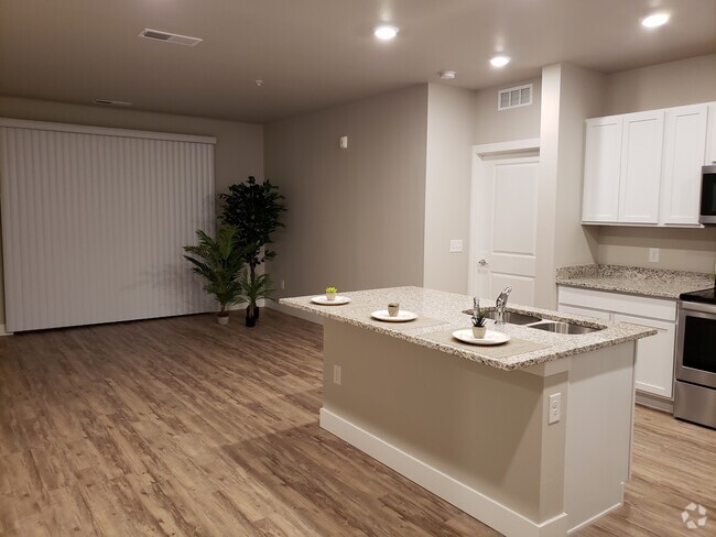 Kitchen opens to living area - 14341 E Tennessee Ave Unit 204 Rental