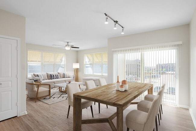 Dining and living room with hard surface vinyl plank flooring