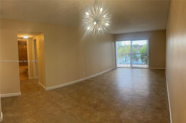 Building Photo - 8600 N Sherman Cir Unit 203 Rental
