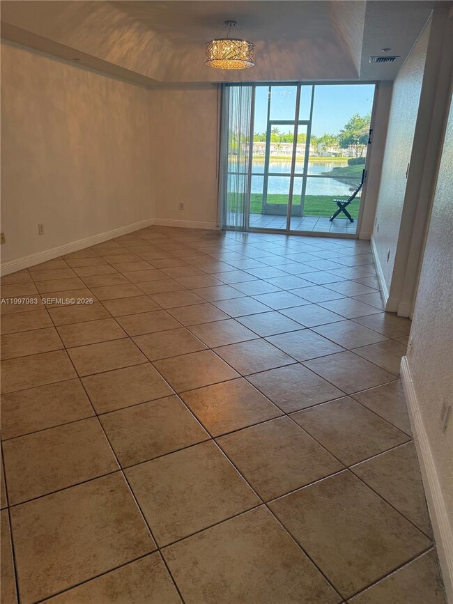 Building Photo - 10720 NW 66th St Unit 112