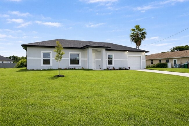 Building Photo - NEW CONSTRUCTION- Modern 3 Bed / 2 Bath Home in Lehigh Acres