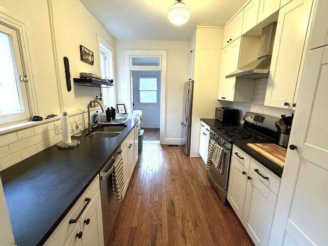 Photo - Remodeled 2 Bed / 2 Bath ½ Townhome | Private Rooftop Patio + Detached Garage |  Available Early ...