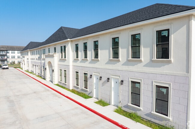Palm Court Townhome Exterior - Palm Court Townhomes