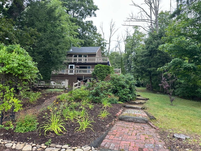 Photo - Peaceful Waterfront Living: 2-Story Home on River Road with Ample Outdoor Storage & Water Extras!