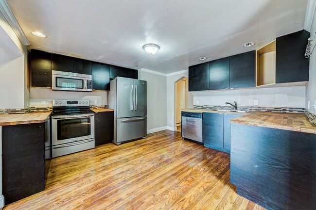 Photo - AVAILABLE AUGUST 2026 - Beautiful 3 Bedroom Home w/ OFF-STREET PARKING & Deck!