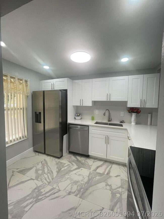 Building Photo - 5980 NW 64th Ave Unit 203