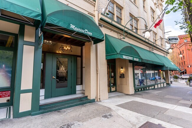 Street view of front of property with green awning