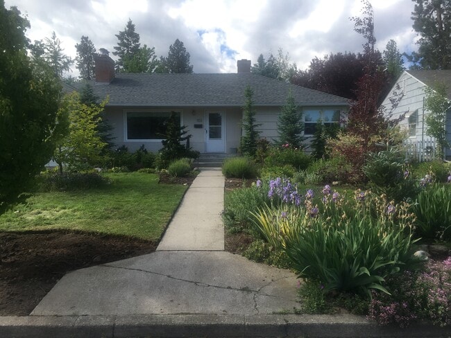 house and front yard - 103 W 30th Ave Unit Bsmt Apartment furnished