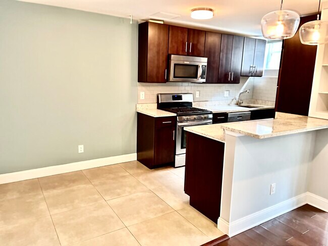 Kitchen with dining area and breakfast nook - 2339 40th Pl NW Unit 4