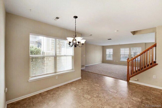 Photo - Bright Open-Concept Condo with 1-Car Garage in Prime Commuter Location