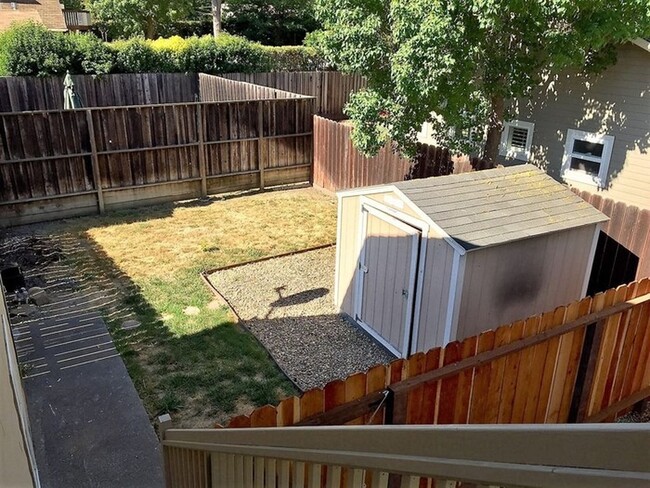 private back yard includes storage shed. - 1839 San Luis Rd Townhome